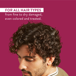 Man with curly hair and text reading “For all hair types from fine to dry damaged, even colored and treated”