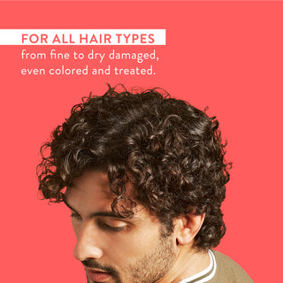 Man with curly hair and text reading “For all hair types from fine to dry damaged, even colored and treated”