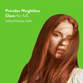 Woman with long red hair with text reading “Locks in moisture and helps strengthen against breakage”