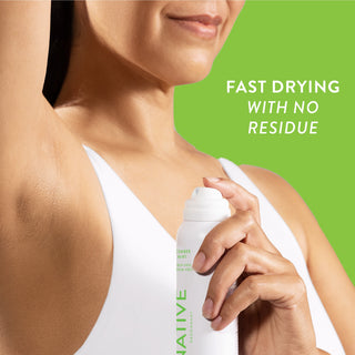 Person applying Native deodorant spray under arm with text reading fast drying with no residue
