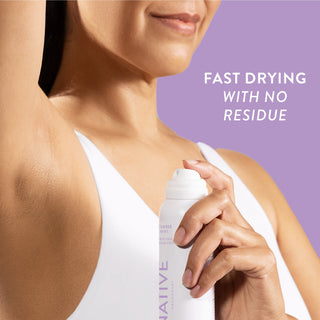 Person applying Native deodorant spray under arm with text reading fast drying with no residue