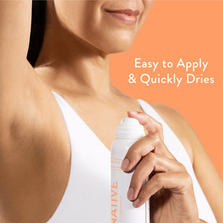 Person applying Native deodorant spray under arm with text reading easy to apply & quickly dries