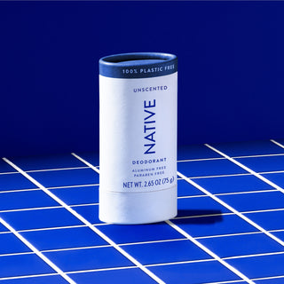 Upright Native deodorant with Unscented label sitting on counter