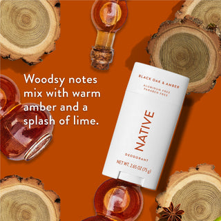 Native deodorant with text saying "Woodsy notes mix with warm amber and a splash of lime", styled with black oak wood pieces