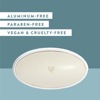 Inside of Native Cashmere & Rain deodorant laid flat on a blue background