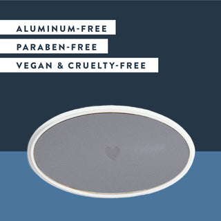 Inside of Native Charcoal deodorant laid flat on blue background