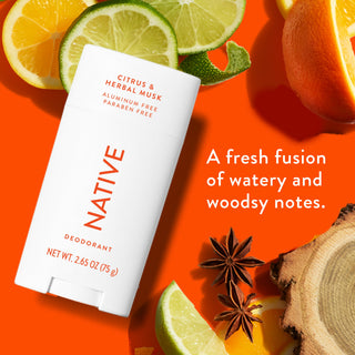 Native deodorant with text saying "A fresh fusion of watery and woodsy notes", styled with lemons, oranges and wood slices