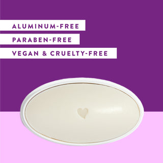 Inside of Native Lavender & Rose deodorant laid flat on purple background