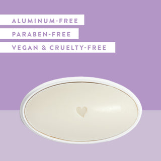 Inside of Native Lilac & White Tea deodorant laid flat on purple background