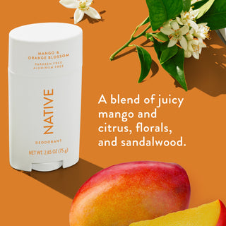 Native deodorant with text saying "A blend of juicy mango and citrus, florals, and sandalwood", styled with a bouquet and a mango