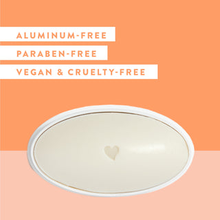 Inside of Native Sweet Peach & Nectar deodorant laid flat on peach background