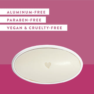 Inside of Native Vanilla & Cactus Flower deodorant laid flat on pink background