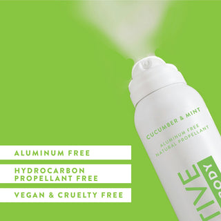 Angled view of Native Whole Body Deodorant in Cucumber & Mint scent spraying, labeled aluminum-free and natural propellant