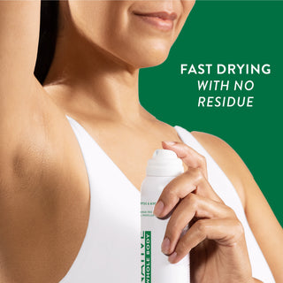 Woman spraying Native Eucalyptus & Mint Whole Body Deodorant under arm, wearing a white tank top