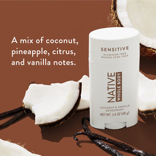 Native Whole Body Deodorant with coconuts slices and vanilla pods on beige background