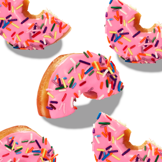 Arrangement of sprinkled donuts cut in half