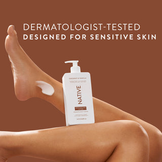 Native Coconut & Vanilla Moisturizing Lotion bottle on a person’s legs, promoting “Dermatologist-Tested designed for sensitive skin”