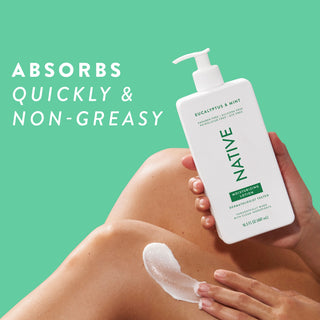 Native Eucalyptus & Mint Moisturizing Lotion bottle being applied to a person's leg, promoting “Absorbs quickly & non-greasy”