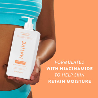 Woman holding Native Sweet Peach & Nectar Moisturizing Lotion bottle with text reading "Formulated with niacinamide to help skin retain moisture"