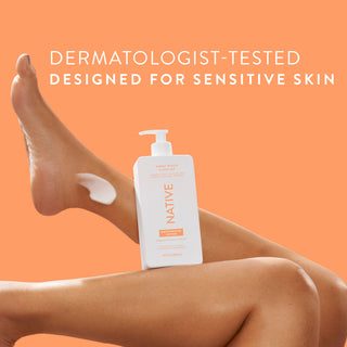 Native Sweet Peach & Nectar Moisturizing Lotion bottle on a person’s legs, promoting “Dermatologist-Tested designed for sensitive skin”