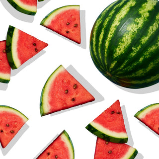 Whole watermelon arranged with triangular watermelon pieces