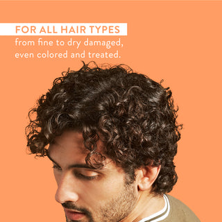 Man with curly hair and text reading “For all hair types from fine to dry damaged, even colored and treated”