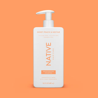 Front of Sweet Peach & Nectar Moisturizing Shampoo bottle on peach background