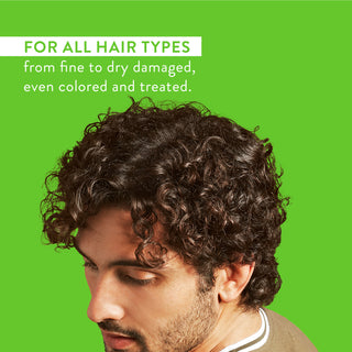 Man with curly hair and text reading “For all hair types from fine to dry damaged, even colored and treated”