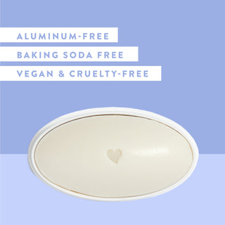 Inside of Native Cotton & Lily sensitive deodorant laid flat on blue background