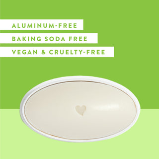 Inside of Native Cucumber & Mint sensitive deodorant laid flat on green background