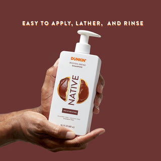 Hand holding Native Dunkin - Boston Kreme Moisturizing Shampoo bottle with text reading “Easy to apply, lather and rinse”