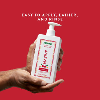 Hand holding Native Jarritos - Passion Fruit Volumizing Shampoo bottle with text reading “Easy to apply, lather, and rinse"