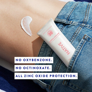 Tube of Native Mineral Suncare Daily Body Sunscreen SPF 30 in a jeans pocket with a swatch of sunscreen on the person's back